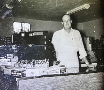 Above, Rudy Lange, owner of Lange’s Grocery, with his National Cash Register. — Family photos